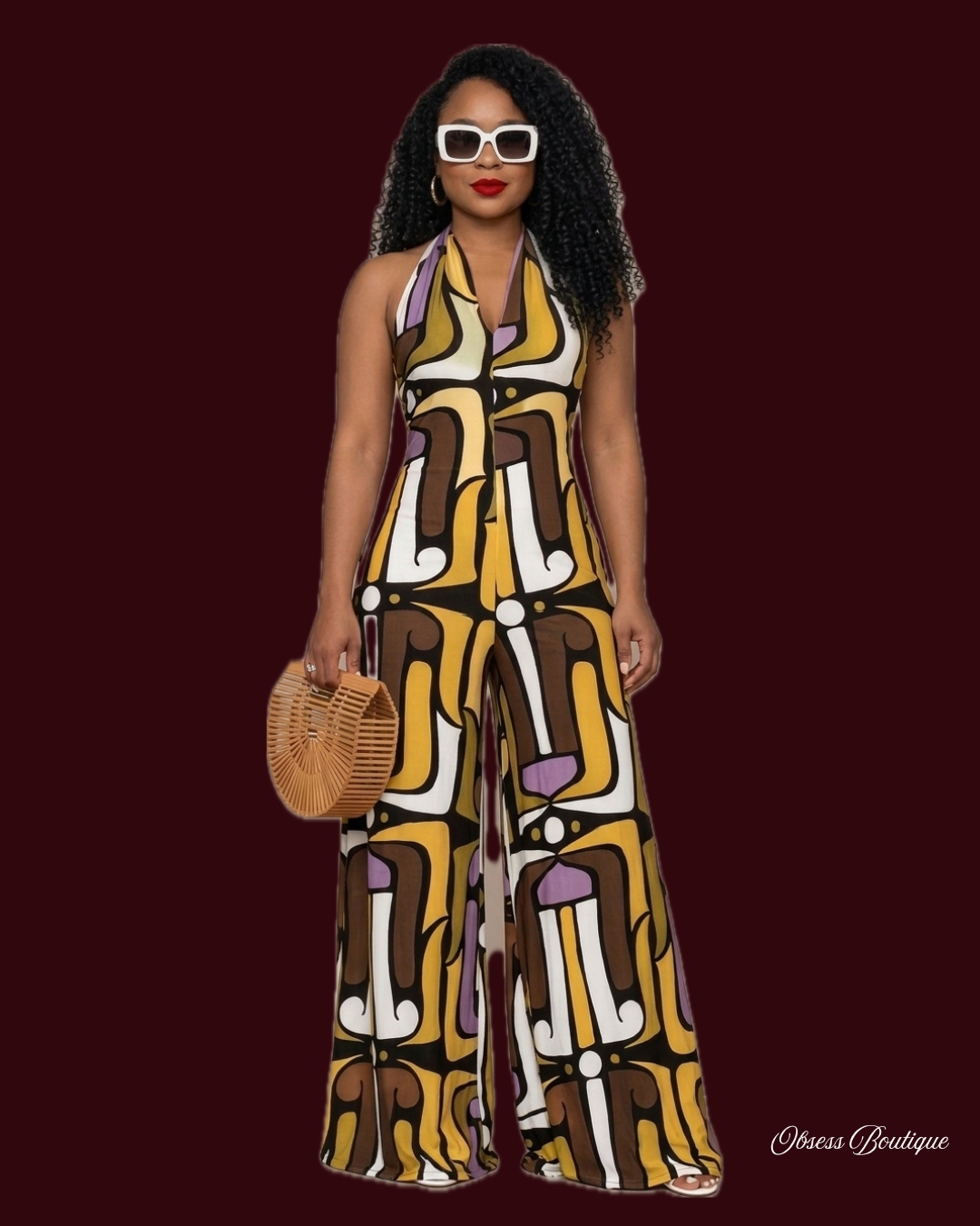 GEO PRINTED HALTER
TIE JUMPSUIT